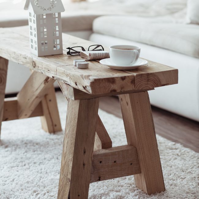 Lady using a wet wipe to wipe her mouth while looking in a mirror